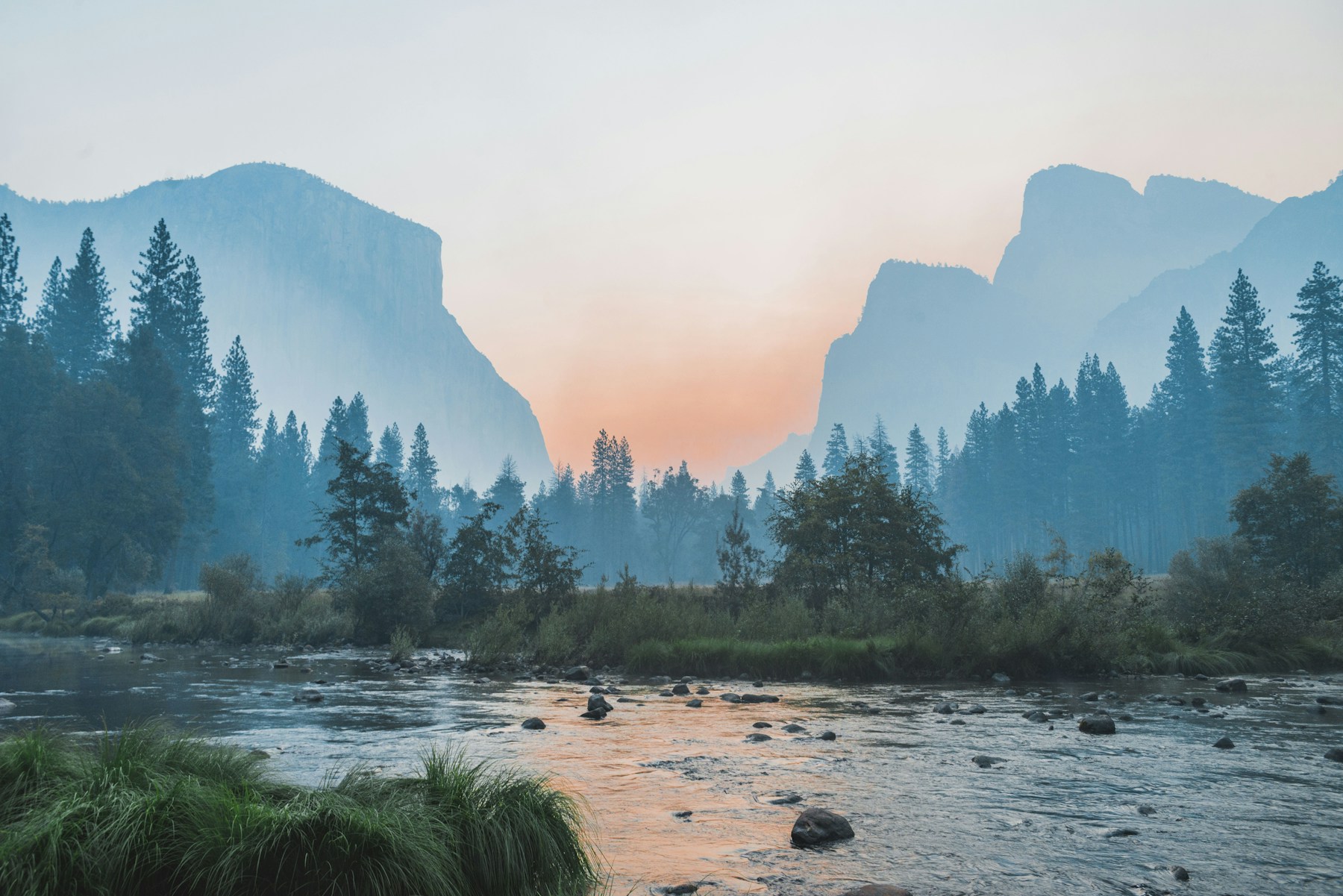 Calm valley river and mountains representing a clear operational route